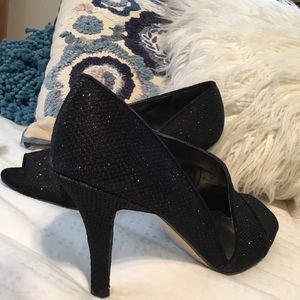 Women’s dress black glitter shoe.